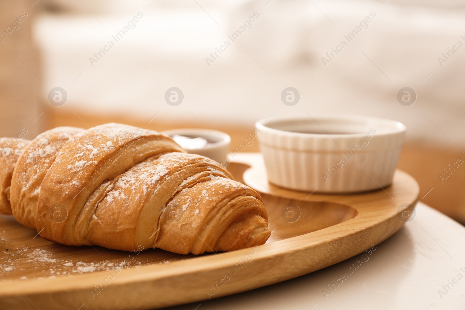 Photo of Delicious croissant and jam on table. Delicious morning meal
