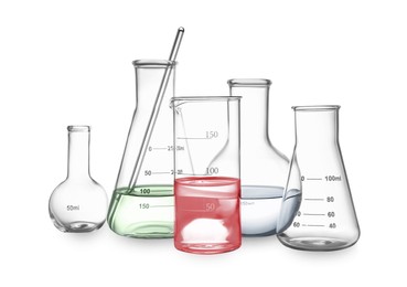Different laboratory glassware with colorful liquids and stirring rod isolated on white