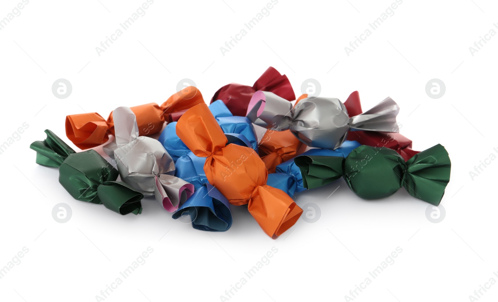 Photo of Many candies in colorful wrappers on white background