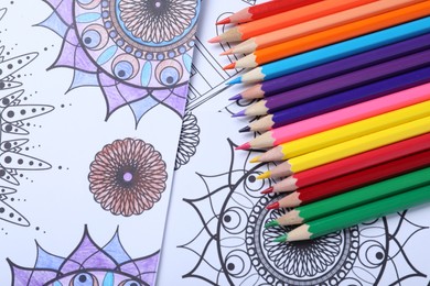 Pencils on antistress coloring pages, top view