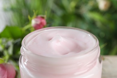 Photo of Jar of hand cream on blurred background, closeup