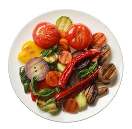 Different delicious grilled vegetables on white background, top view