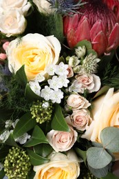 Beautiful bouquet with roses as background, closeup