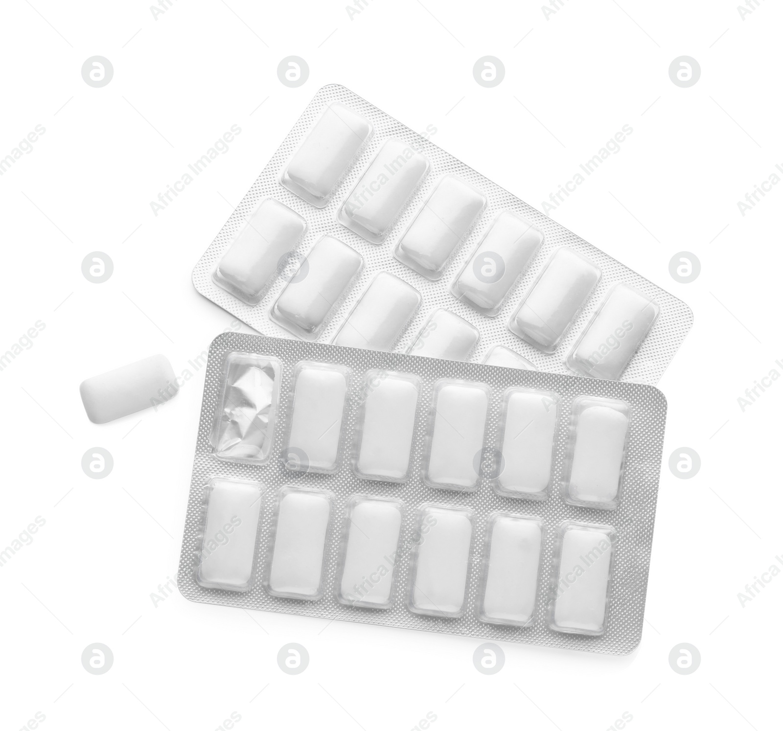 Photo of Blisters with chewing gums on white background, top view