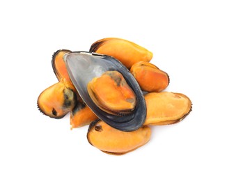 Photo of Heap of delicious cooked mussels on white background, top view