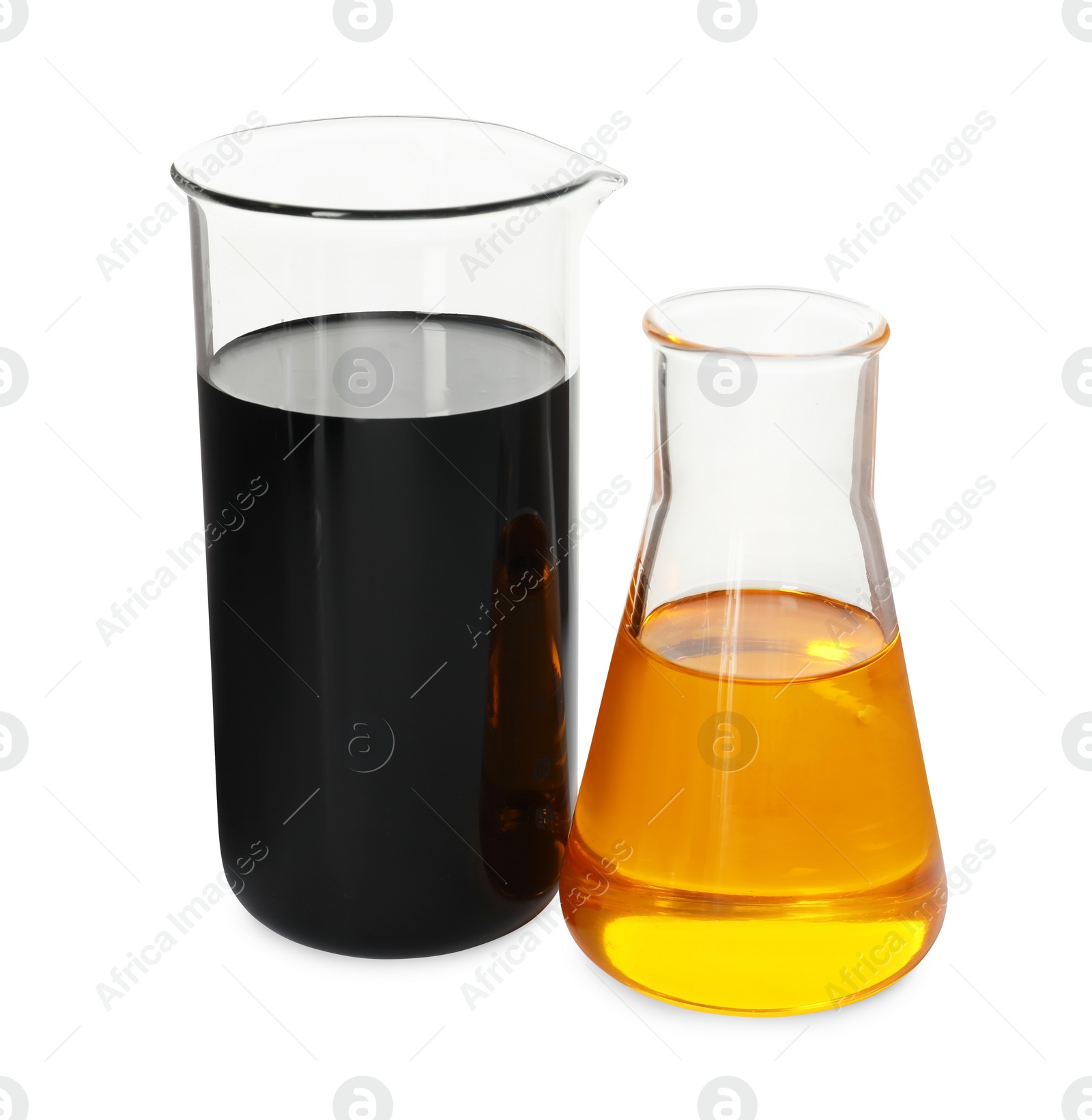 Photo of Beaker and flask with different types of oil isolated on white