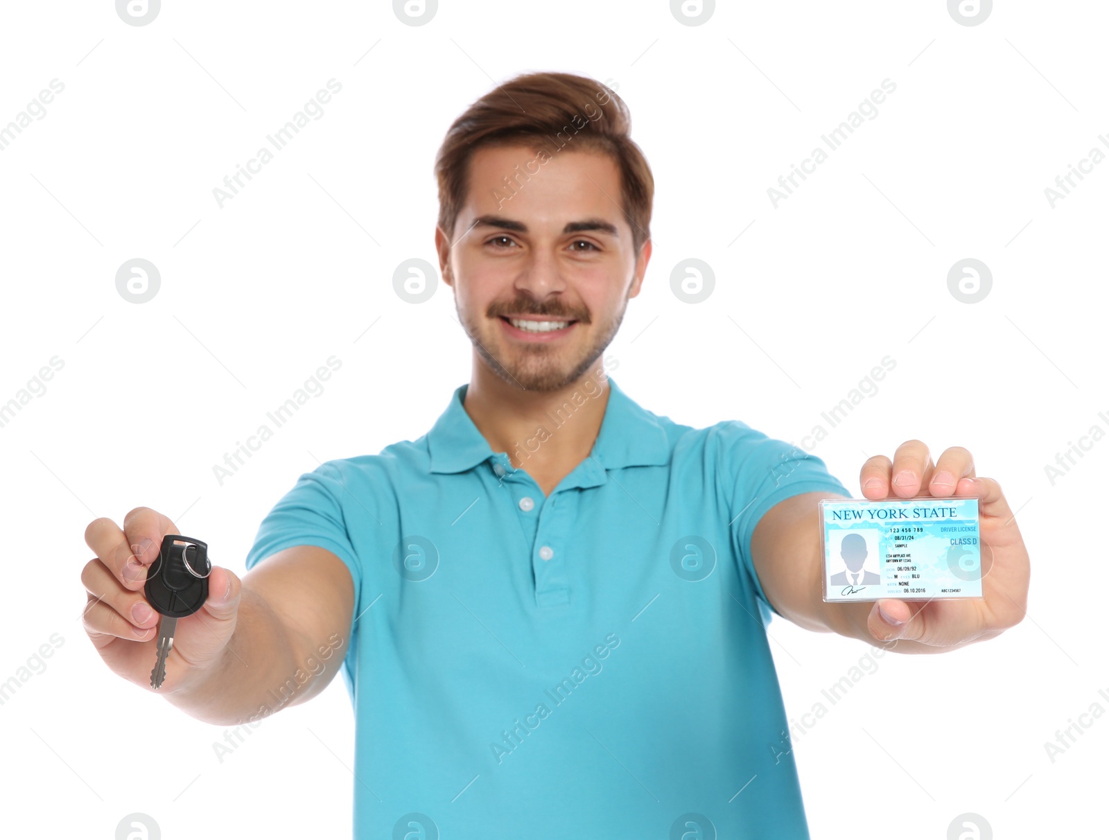 Photo of Happy young man with driving license and car key on white background
