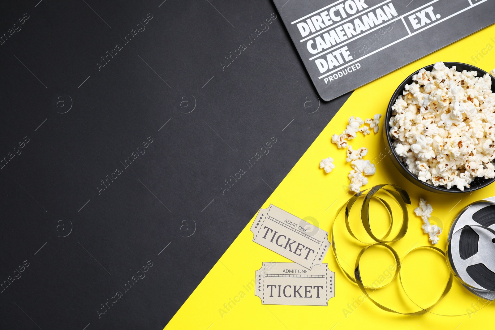 Photo of Flat lay composition with clapperboard, popcorn and cinema tickets on color background, space for text