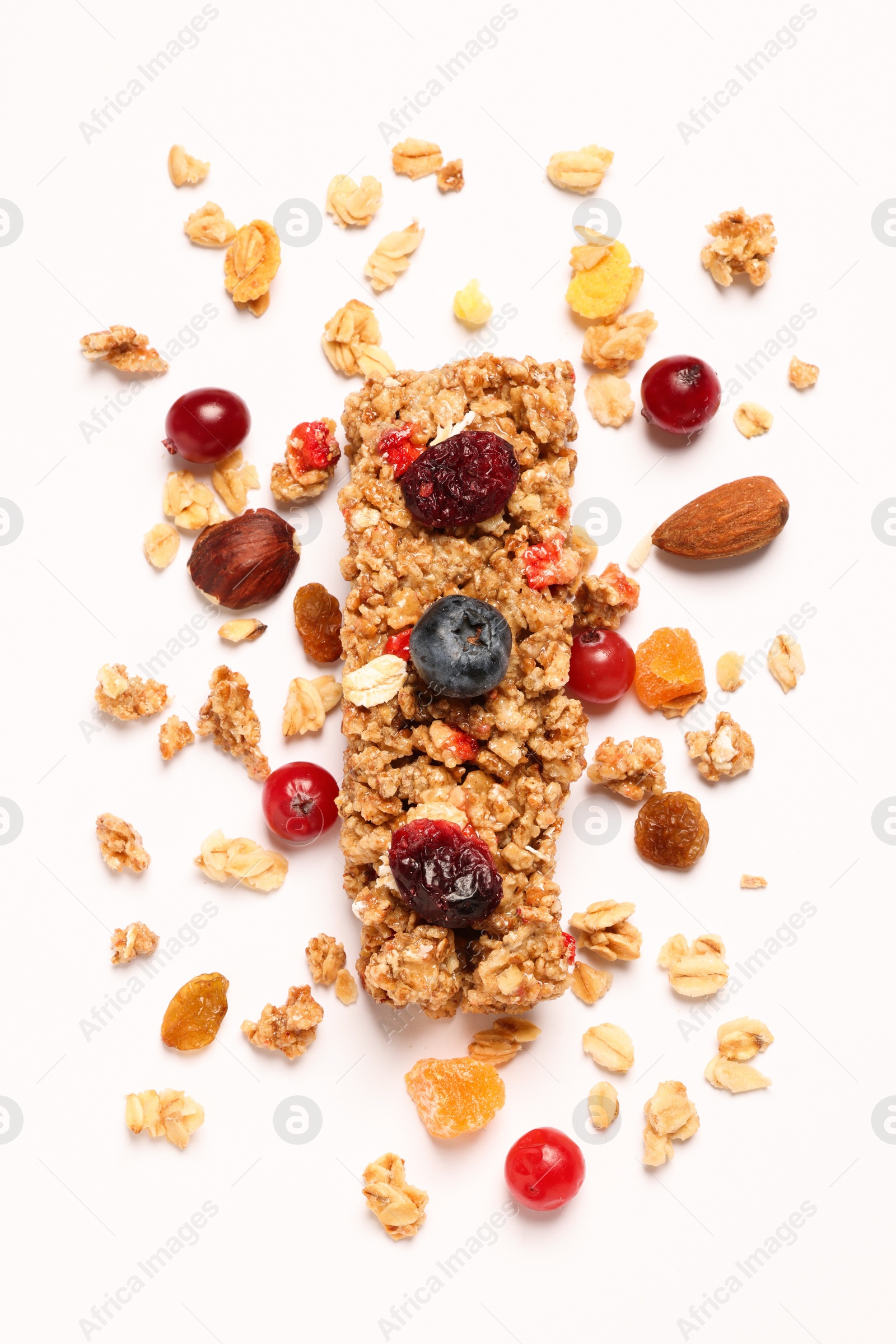 Photo of Tasty granola bar and ingredients isolated on white, top view