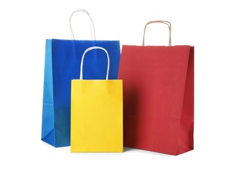 Photo of Mockup of paper shopping bags on white background