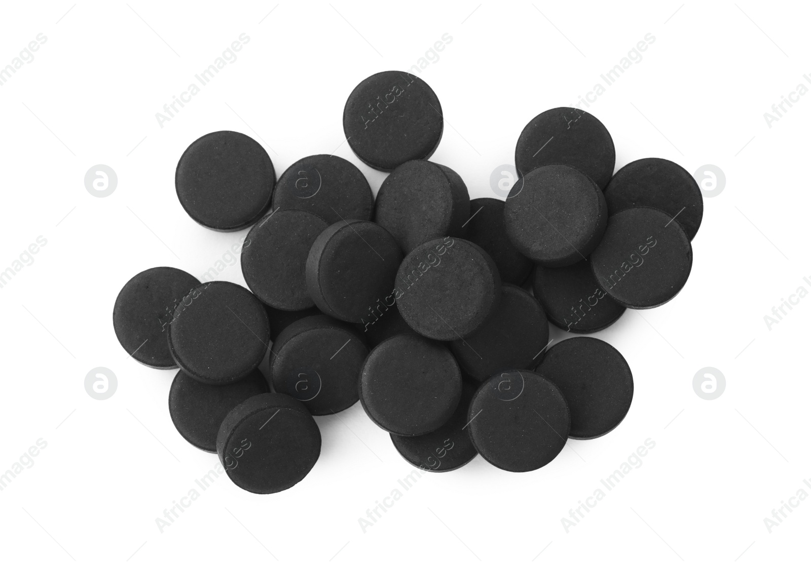 Photo of Activated charcoal pills on white background, top view. Potent sorbent