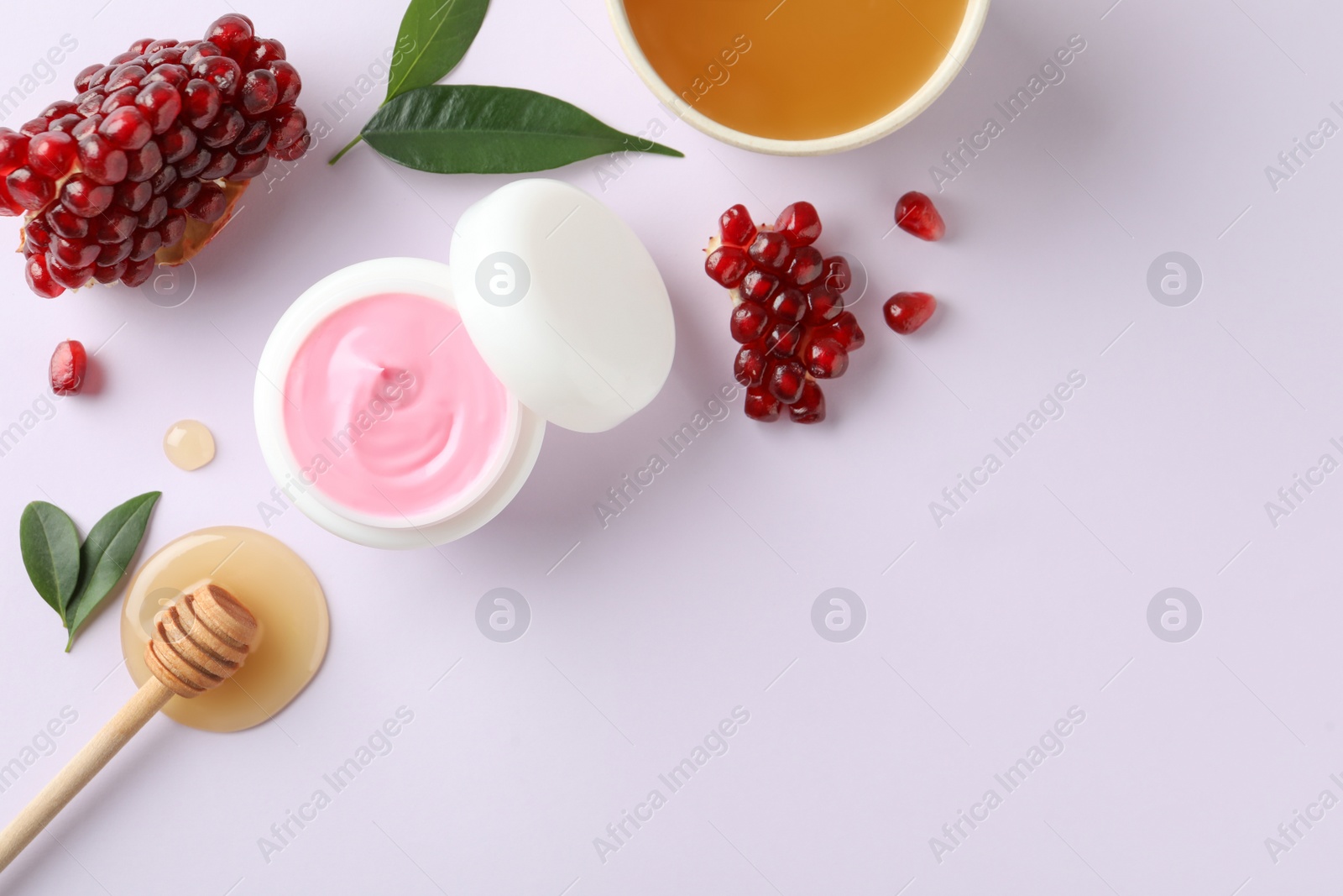 Photo of Composition with natural homemade mask, pomegranate and ingredients on white background, top view