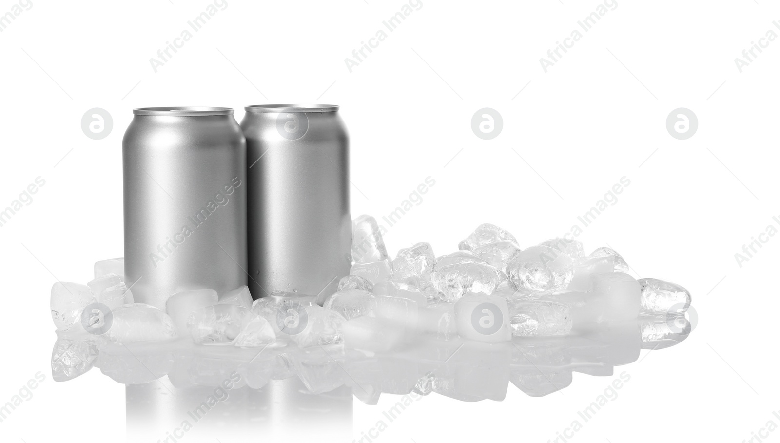 Photo of Tin cans and ice cubes on white background