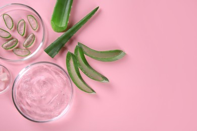 Photo of Flat lay composition with aloe vera leaves and cosmetic gel on pink background. Space for text