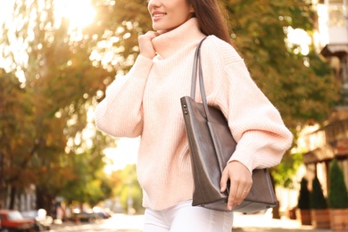 Photo of Woman with stylish shopper bag outdoors, closeup