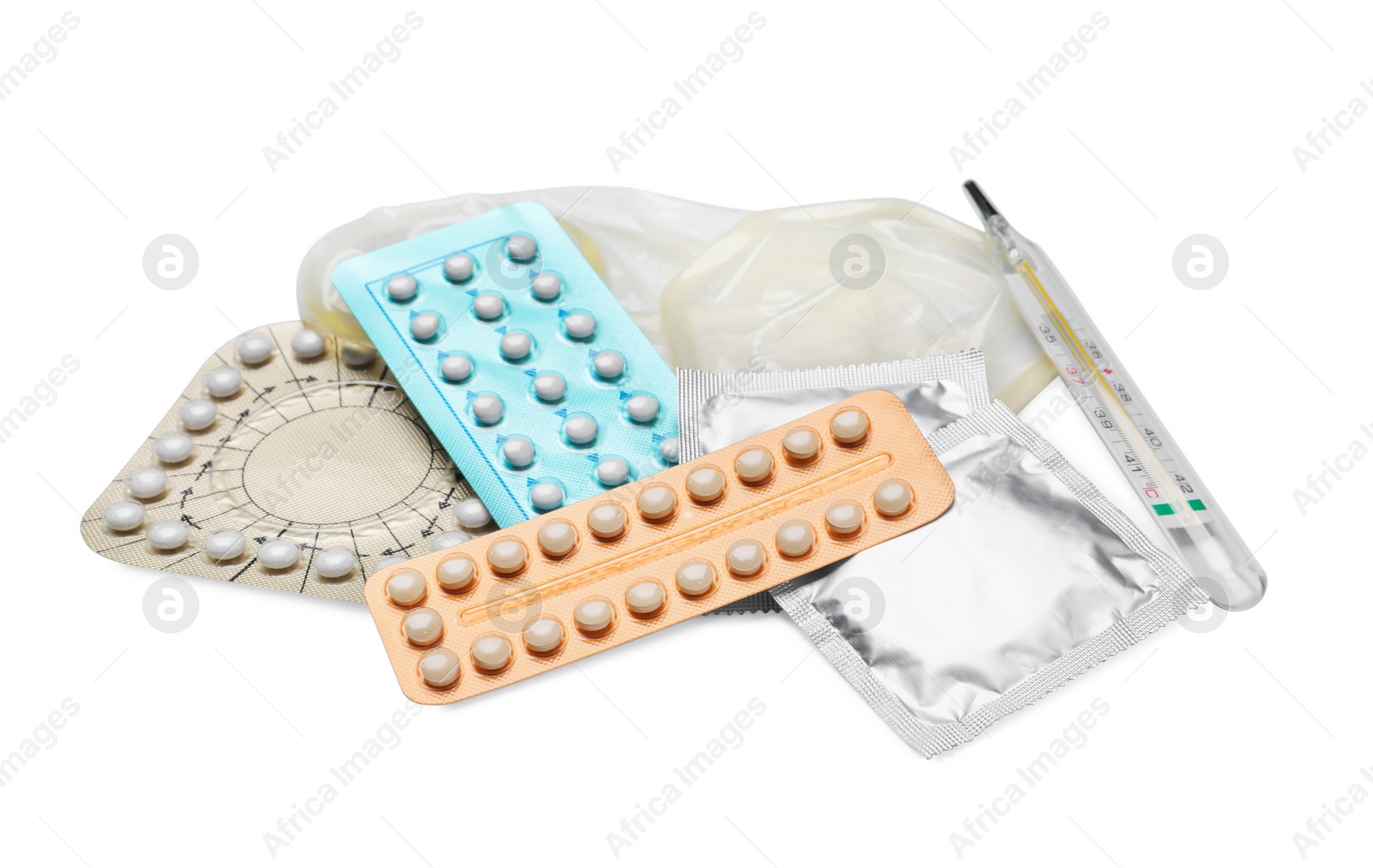 Photo of Contraceptive pills, condoms and thermometer isolated on white. Different birth control methods