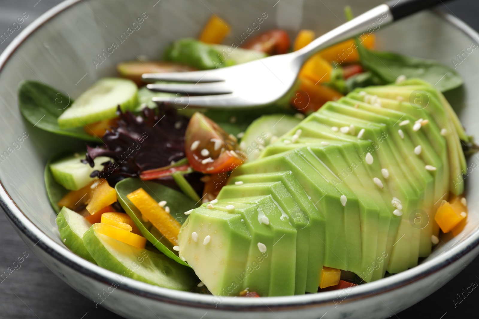 Photo of Healthy dish high in vegetable fats in bowl on table, closeup