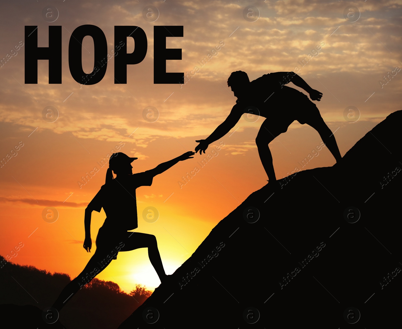 Image of Concept of hope. Man helping woman to climb on hill at sunset