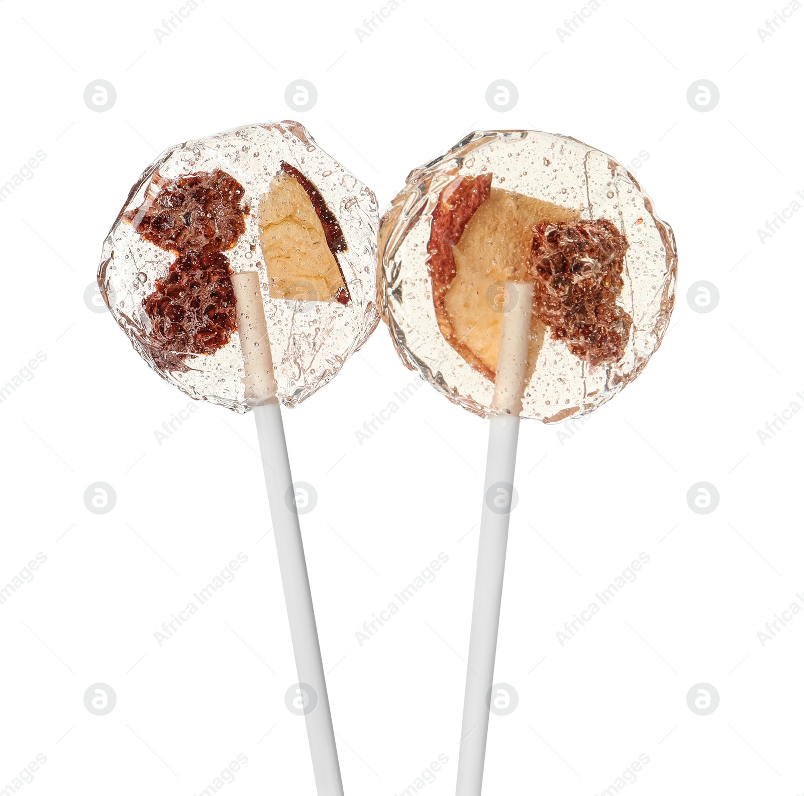 Photo of Sweet colorful lollipops with berries on white background