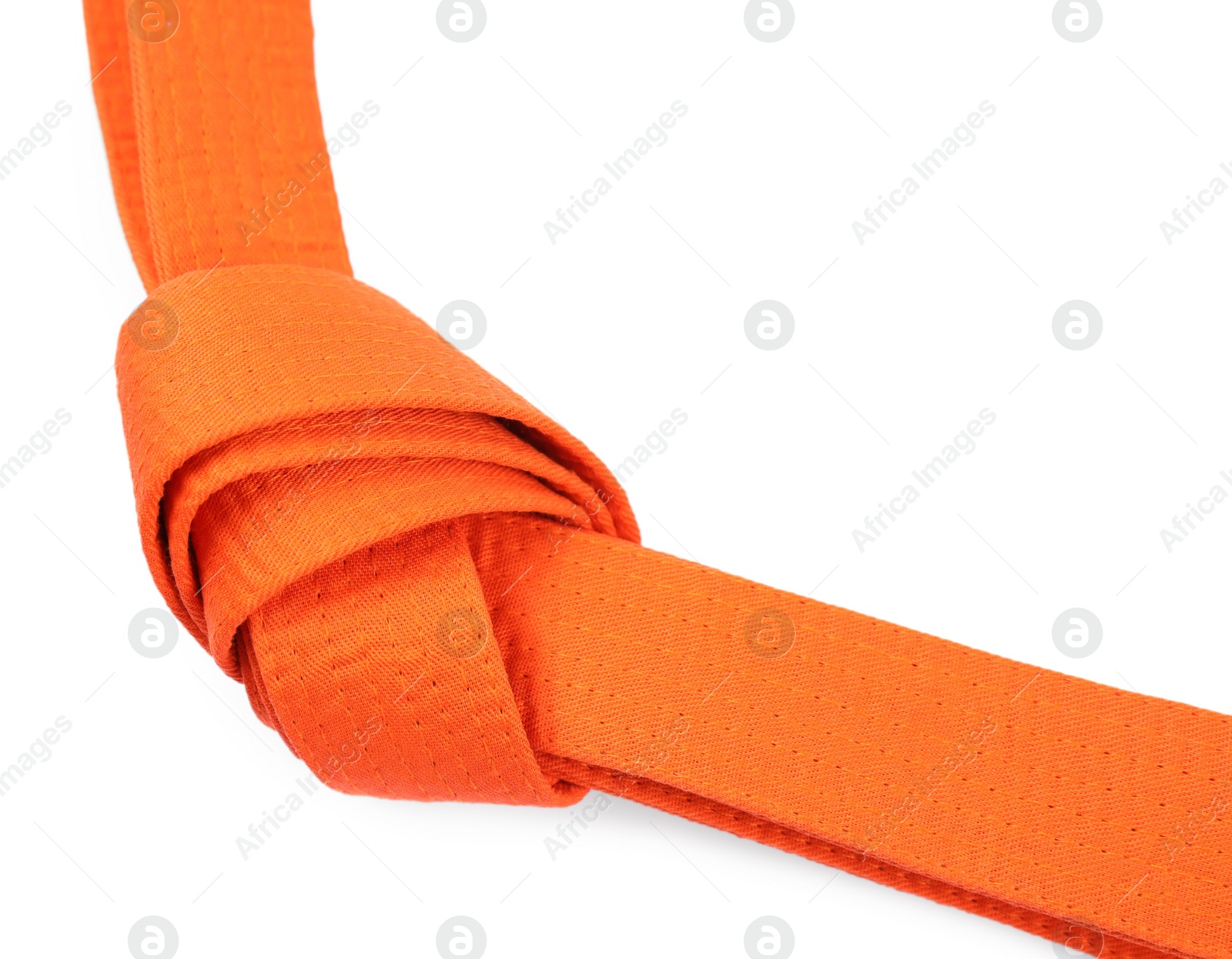 Photo of Orange karate belt isolated on white. Martial arts uniform