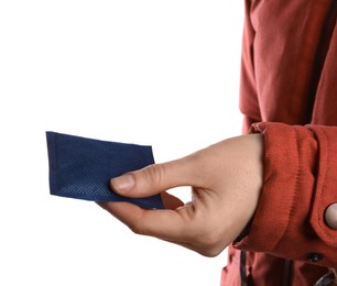 Woman holding hand warmer on white background, closeup