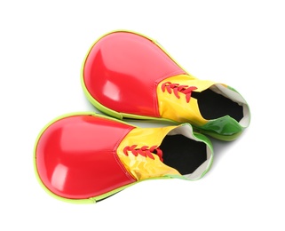 Pair of clown shoes isolated on white, top view