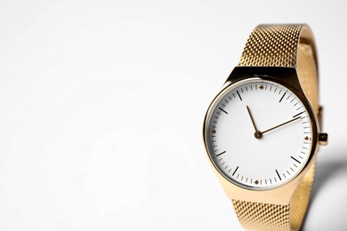 Photo of Luxury wrist watch on white background. Fashion accessory