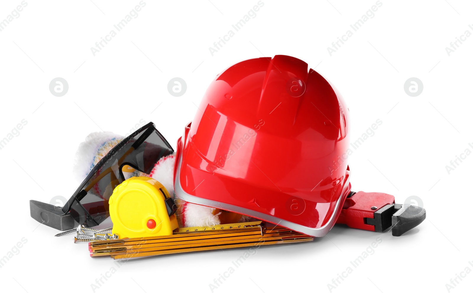 Photo of Different construction tools and hard hat isolated on white