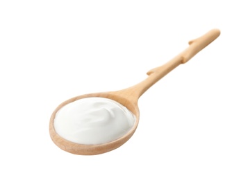 Spoon with creamy yogurt on white background