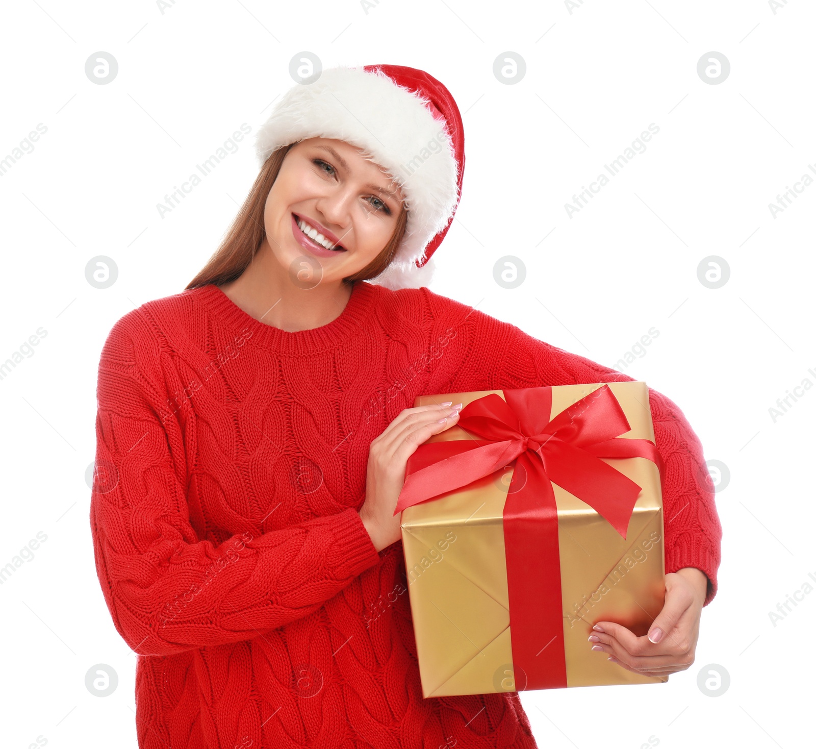 Photo of Happy young woman in Santa hat with Christmas gift on white background