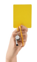 Photo of Referee holding yellow card and whistle on white background, closeup