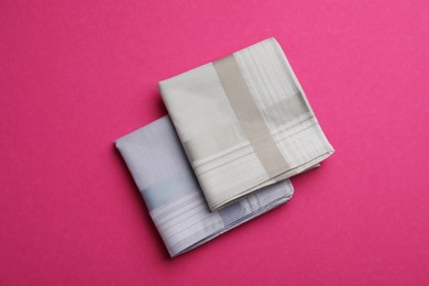Photo of Stylish handkerchiefs on pink background, flat lay