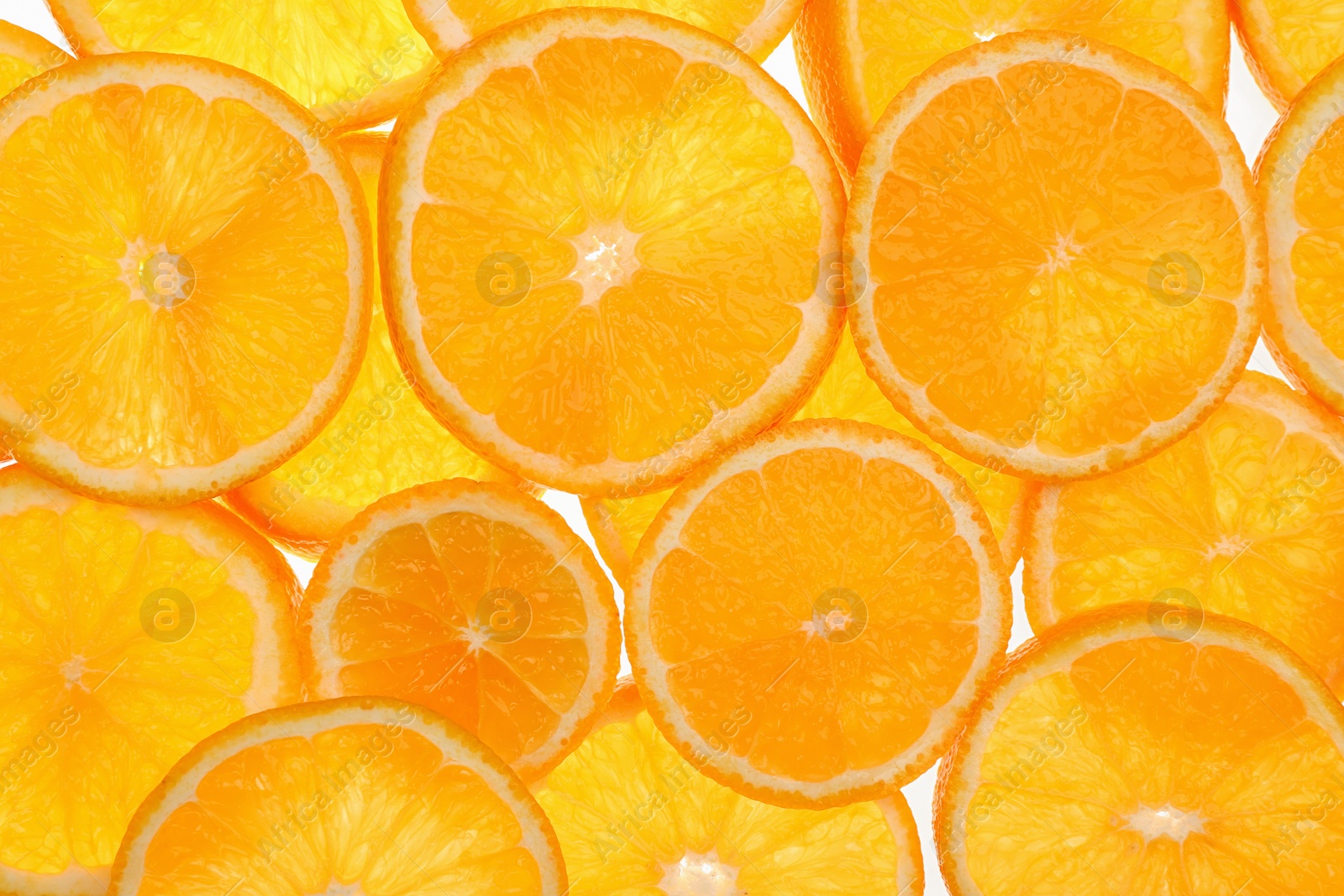 Photo of Slices of fresh tangerines as background, top view