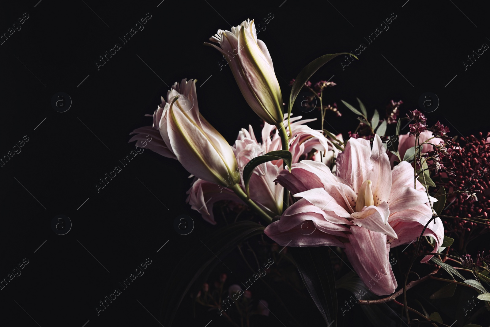 Photo of Beautiful bouquet of different flowers on black background. Floral card design with dark vintage effect