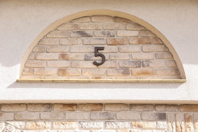Photo of House number 5c on brick building outdoors