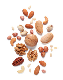 Photo of Different delicious nuts on white background, flat lay. Space for text