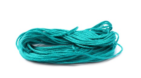 Photo of Bright turquoise embroidery thread on white background