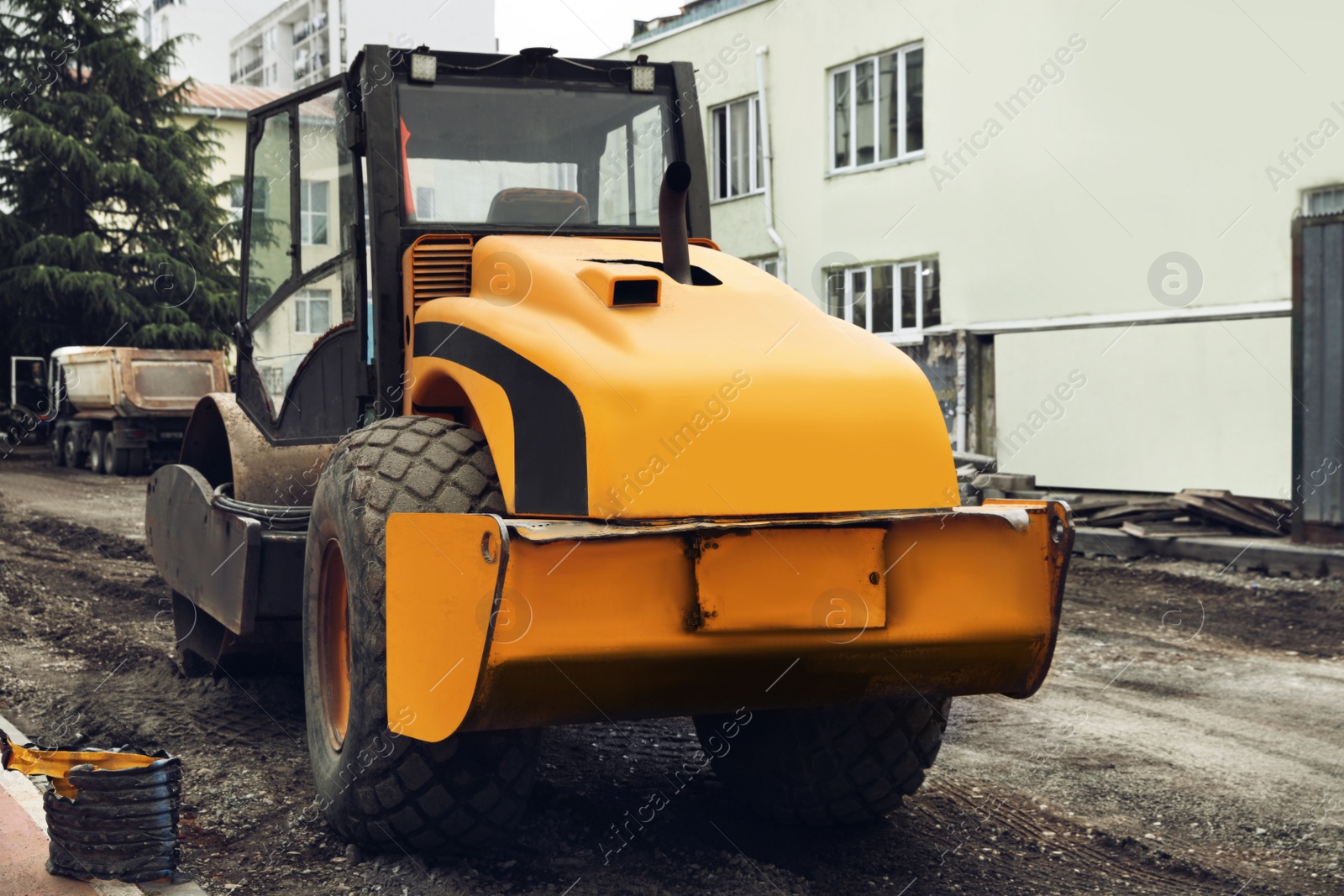 Photo of Modern soil roller working on city street