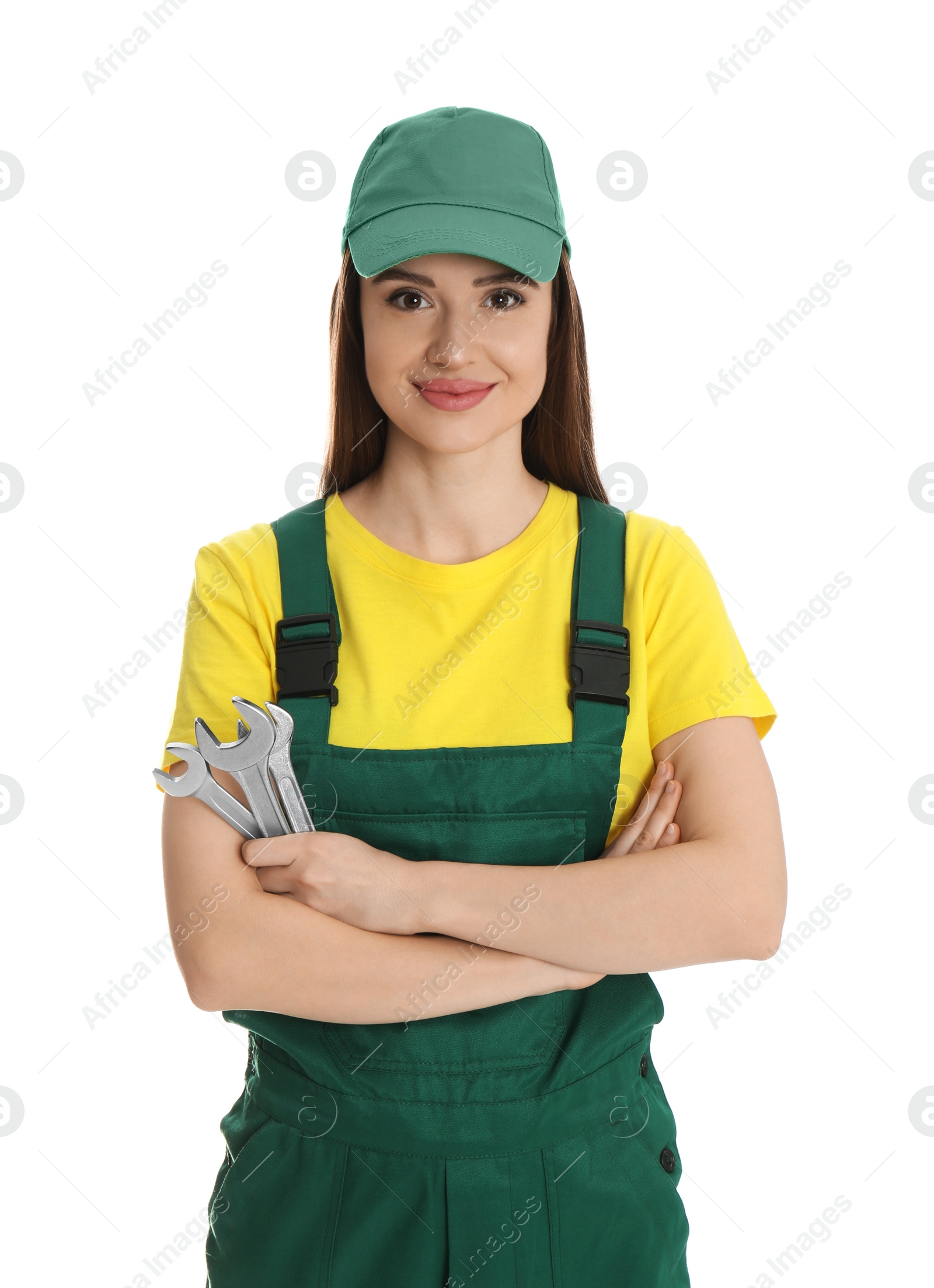 Photo of Portrait of professional auto mechanic with wrenches on white background