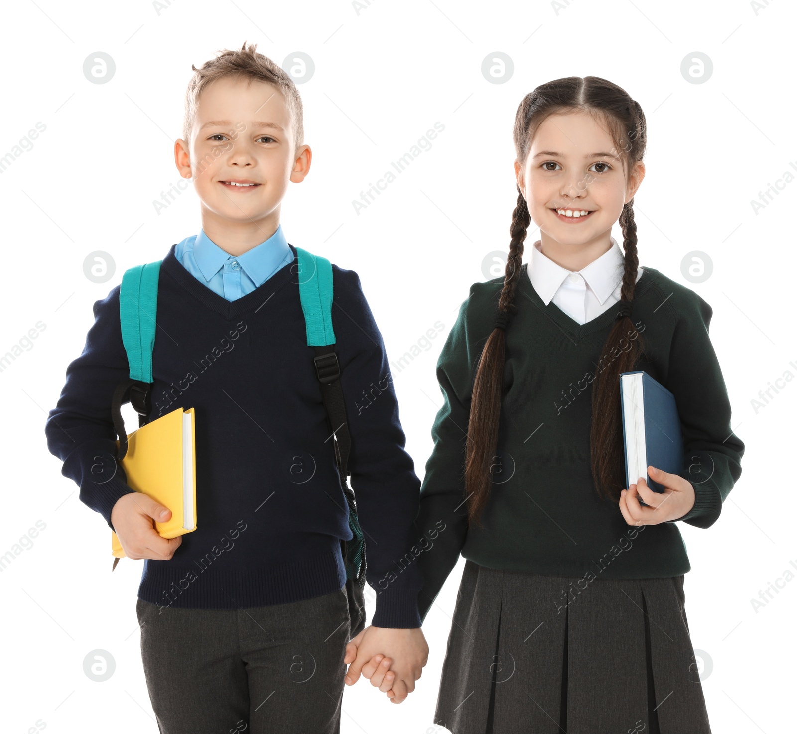 Photo of Portrait of cute children in school uniform on white background