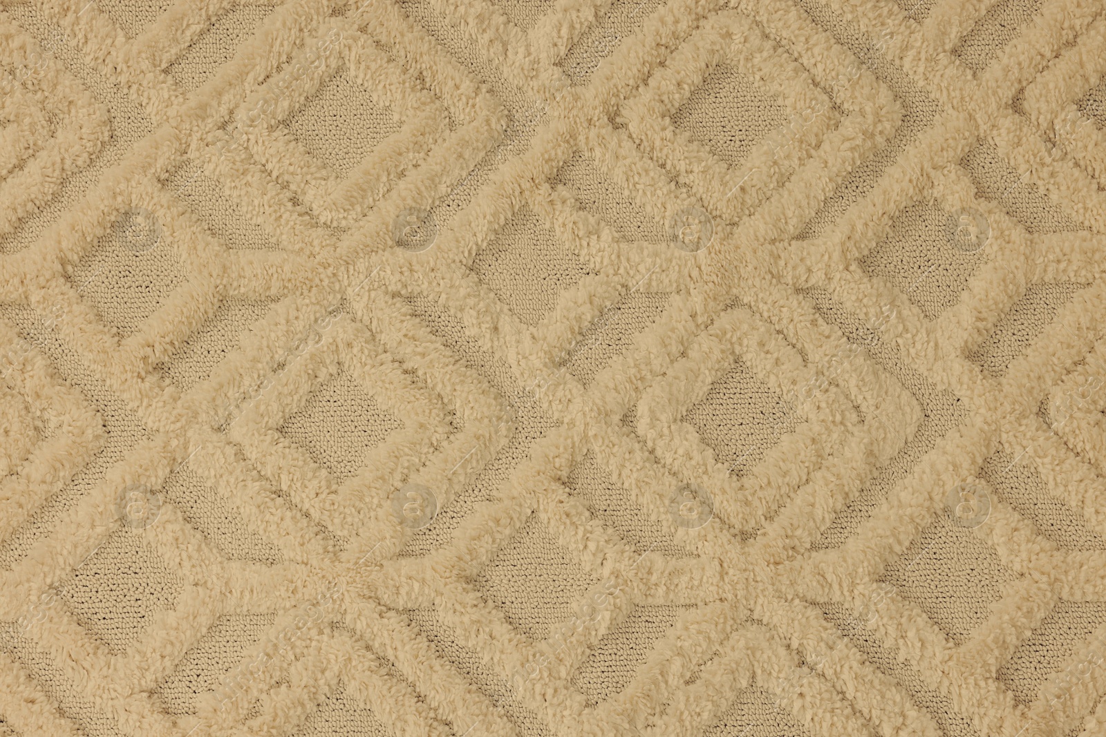 Image of Soft beige carpet with pattern as background, top view