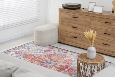 Photo of Stylish living room with beautiful carpet and furniture. Interior design