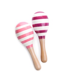 Wooden toy maracas on white background, top view