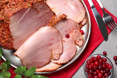 Flat lay composition with delicious ham for Christmas dinner on grey table