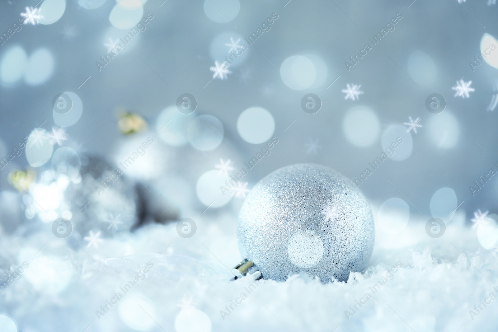 Image of Greeting card design with beautiful Christmas ball and snowflakes, bokeh effect