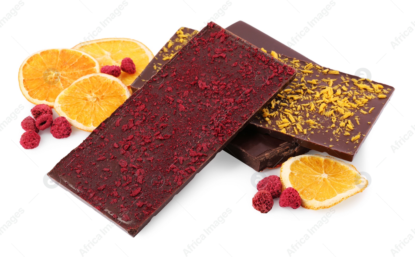 Photo of Chocolate bars with freeze dried fruits, raspberries and orange slices on white background