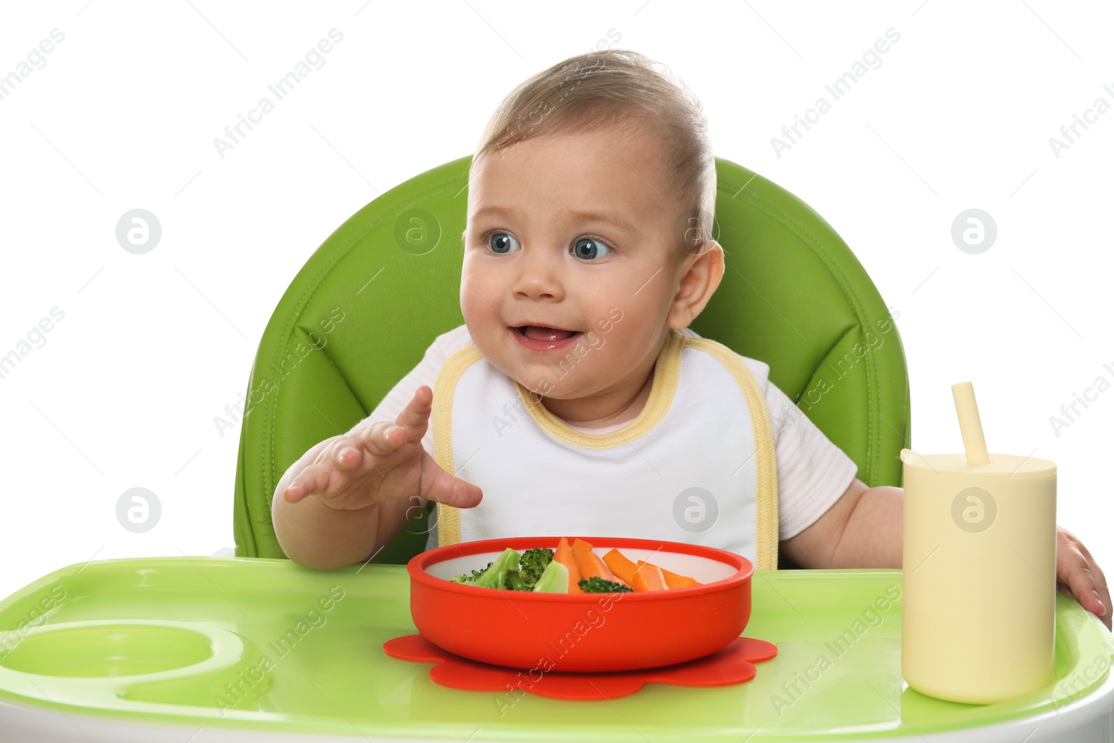 Photo of Cute little baby wearing bib while eating on white background