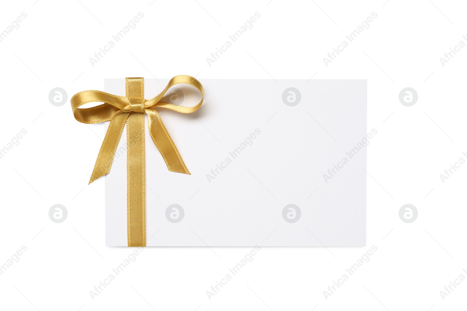 Photo of Blank gift card with golden bow isolated on white, top view