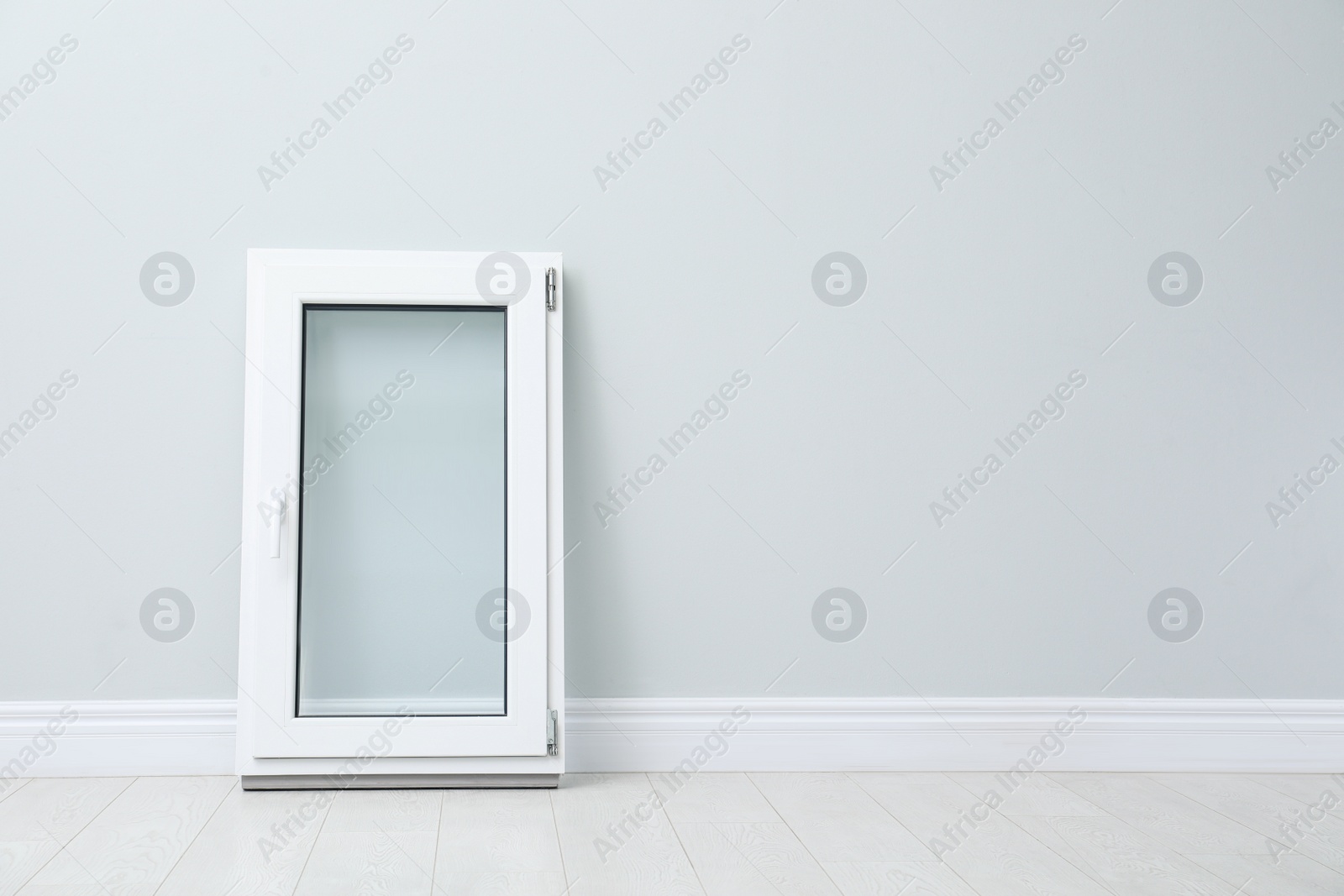 Photo of Modern single casement window near light grey wall indoors, space for text
