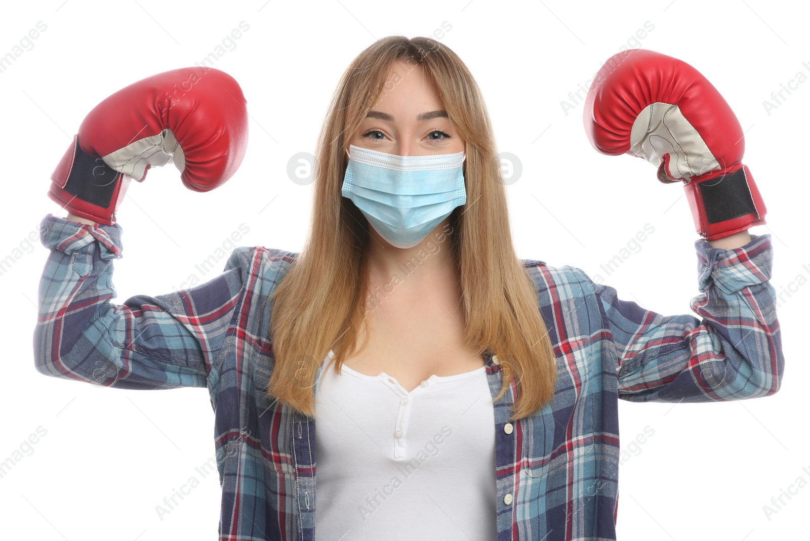 Photo of Woman with protective mask and boxing gloves on white background. Strong immunity concept